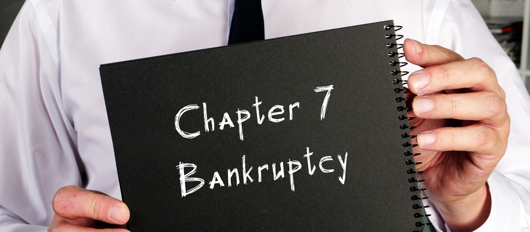 A person holding a Chapter 7 Bankruptcy sign - Meredith Law Firm, LLC - Chapter 7 Bankruptcy Attorneys - Columbia, SC