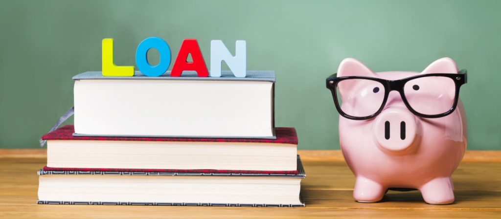A pig with glasses next to a stack of books and Loan -Meredith Law Firm, LLC - Student Loan Debt - North Charleston, S.C.