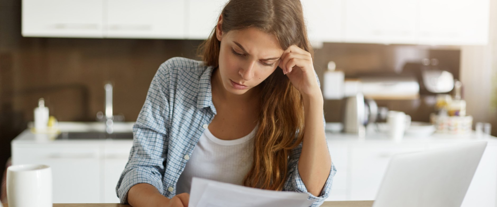 A women reading over documents - Meredith Law Firm, LLC - Chapter 13 Bankruptcy Lawyers - North Charleston, SC