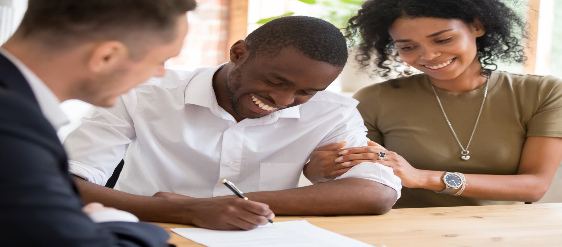 A couple is meeting with a lawyer to discuss bankruptcy terms. - Meredith Law Firm, Bankruptcy Lawyers - North Charleston, SC.